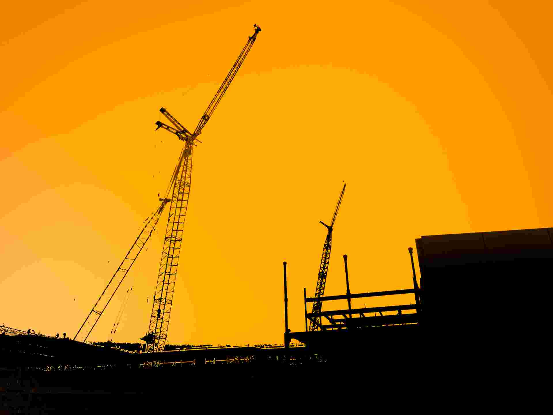 Port infrastructure — cranes against an overcast sky